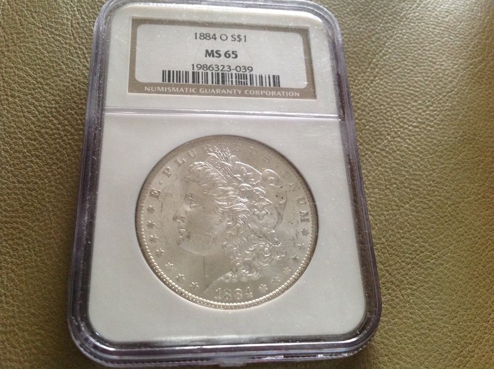 1884-O $1 Morgan Silver Dollar graded MS65 by NGC, MS65 - PCGS